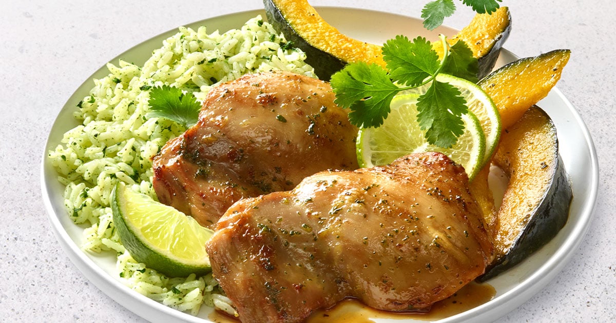 plate of chicken thighs and cilantro rice